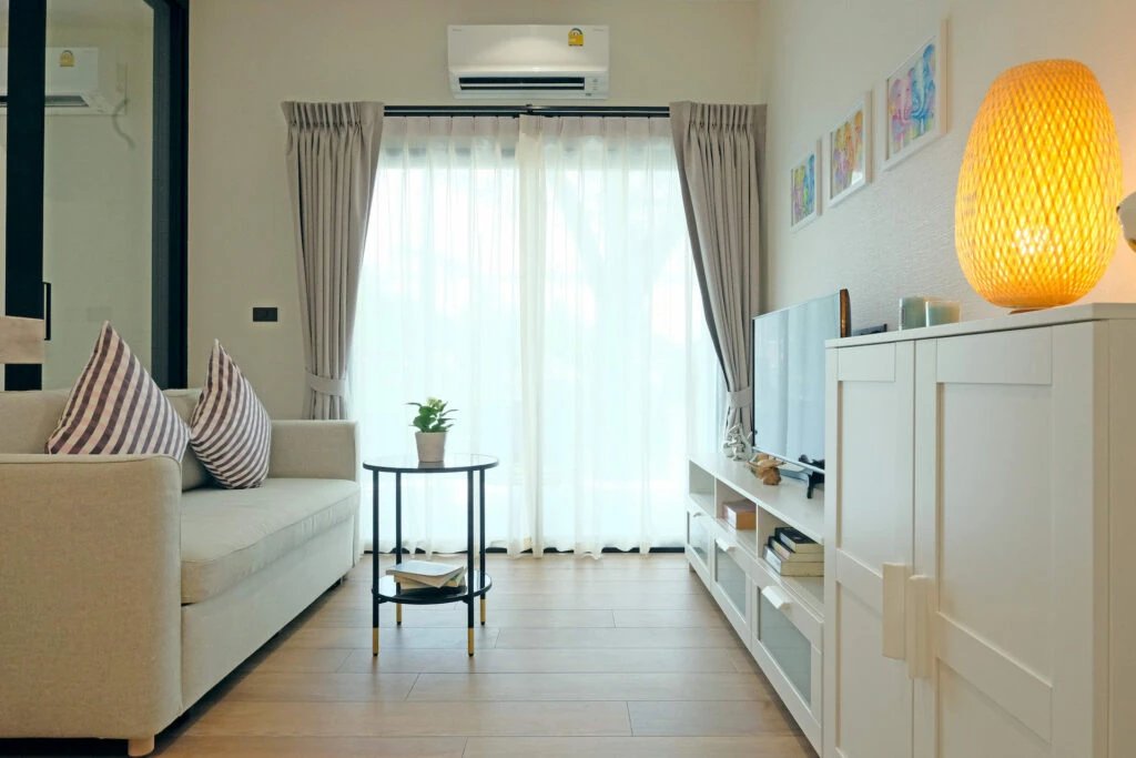 The Title Halo 1 — living room with courtyard view